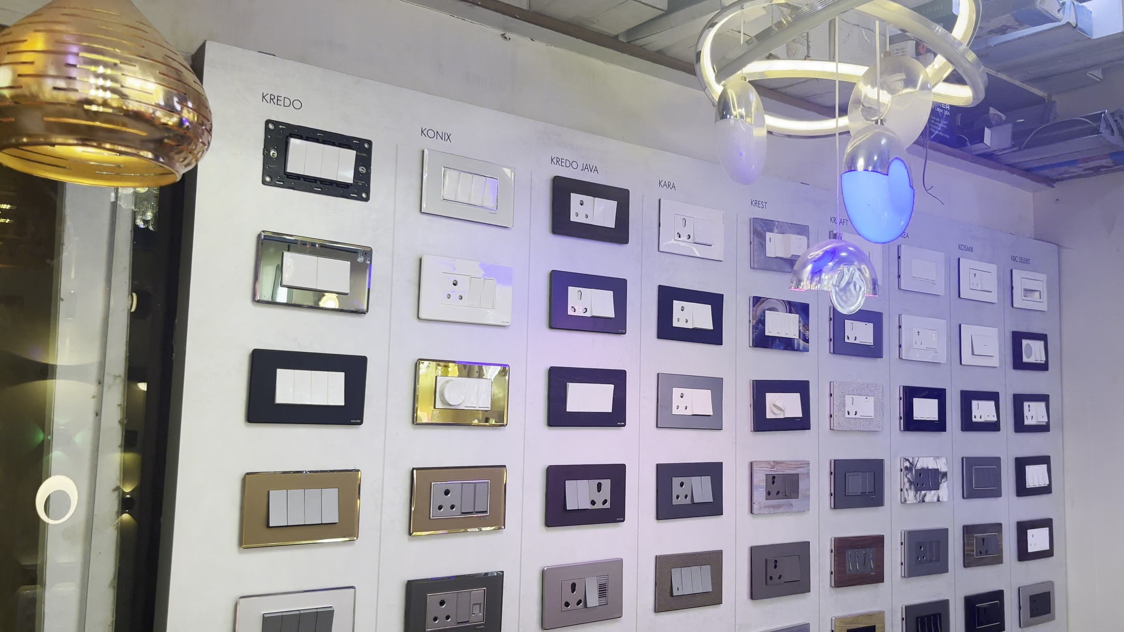 Modular sockets and switch plates mounted in rows on the electrical display wall