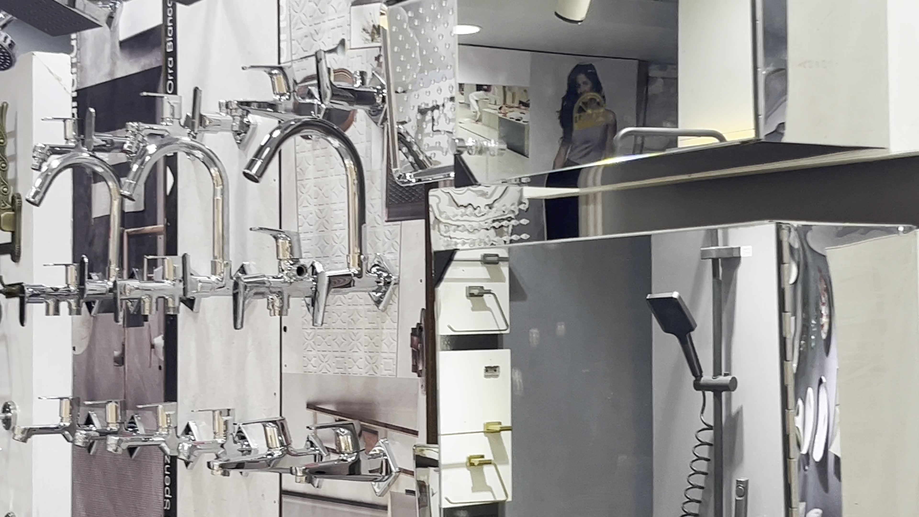 Chrome faucets and single-lever mixers on the bath fittings wall